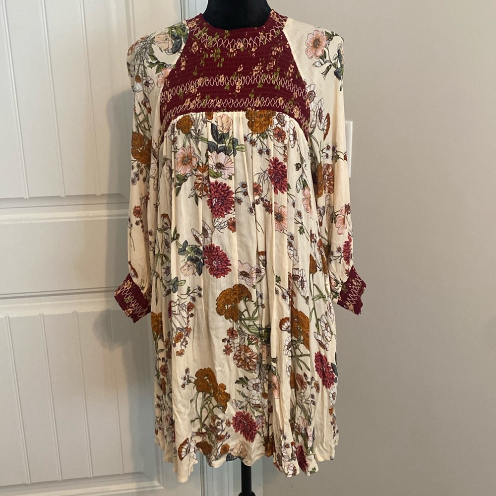 Umgee Floral Dress. Size small. NWT. Smocked chest, neckline and sleeve cuffs